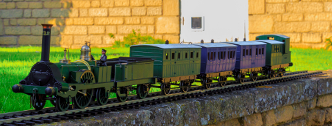 Photo of 4-4-2 Megatherium at work in the owner’s garden with a train of four carriages