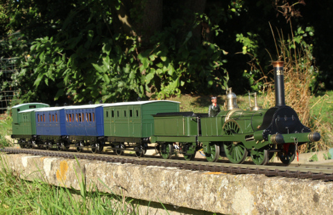 Photo of 4-4-2 Megatherium at work in the owner’s garden with a train of four carriages
